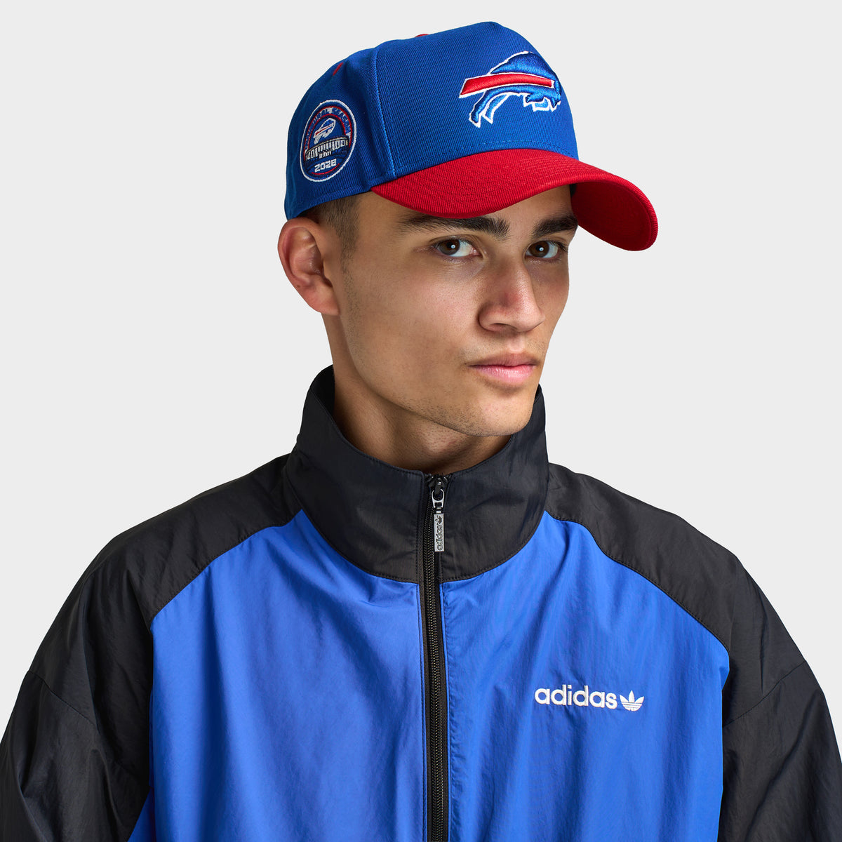 New Era Buffalo Bills 9FORTY AF. Front view of model wearing royal and red cap with red curved brim, Buffalo Bills logo and side patch.