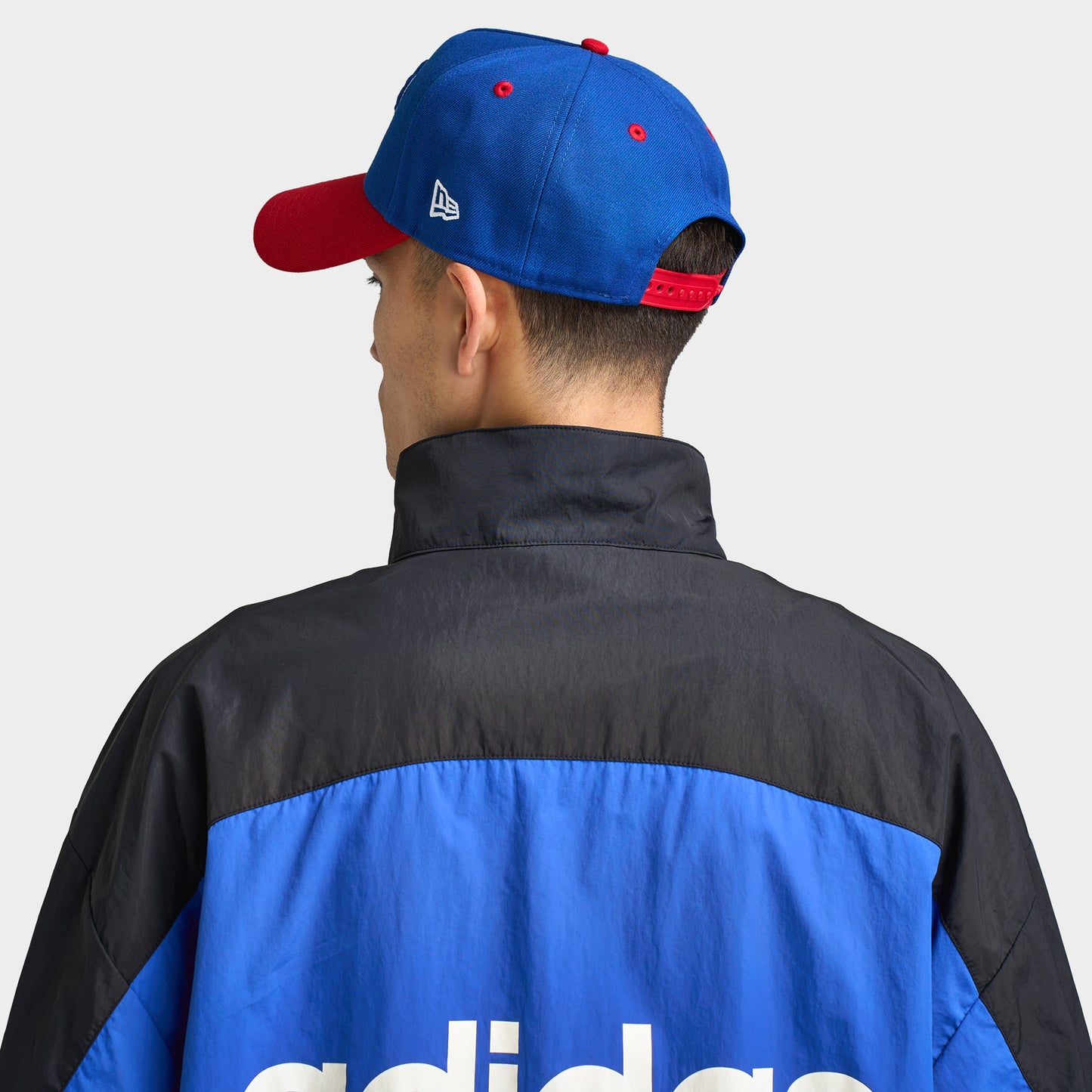New Era Buffalo Bills 9FORTY AF. Back view of model wearing royal and red cap with adjustable closure and structured crown.
