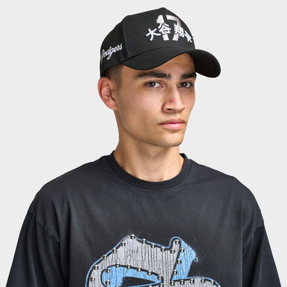 New Era LA Dodgers Shohei 9FORTY AF Snapback. Front view of model wearing black cap with curved brim, white Shohei-inspired graphic and embroidered side details.
