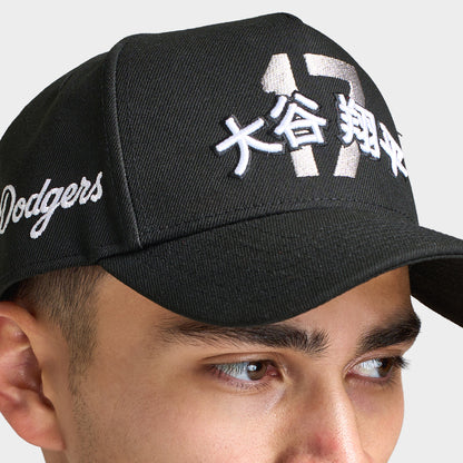 New Era LA Dodgers Shohei 9FORTY AF Snapback. Close-up of black cap showing the white Shohei-inspired front graphic, curved brim and embroidered side script.