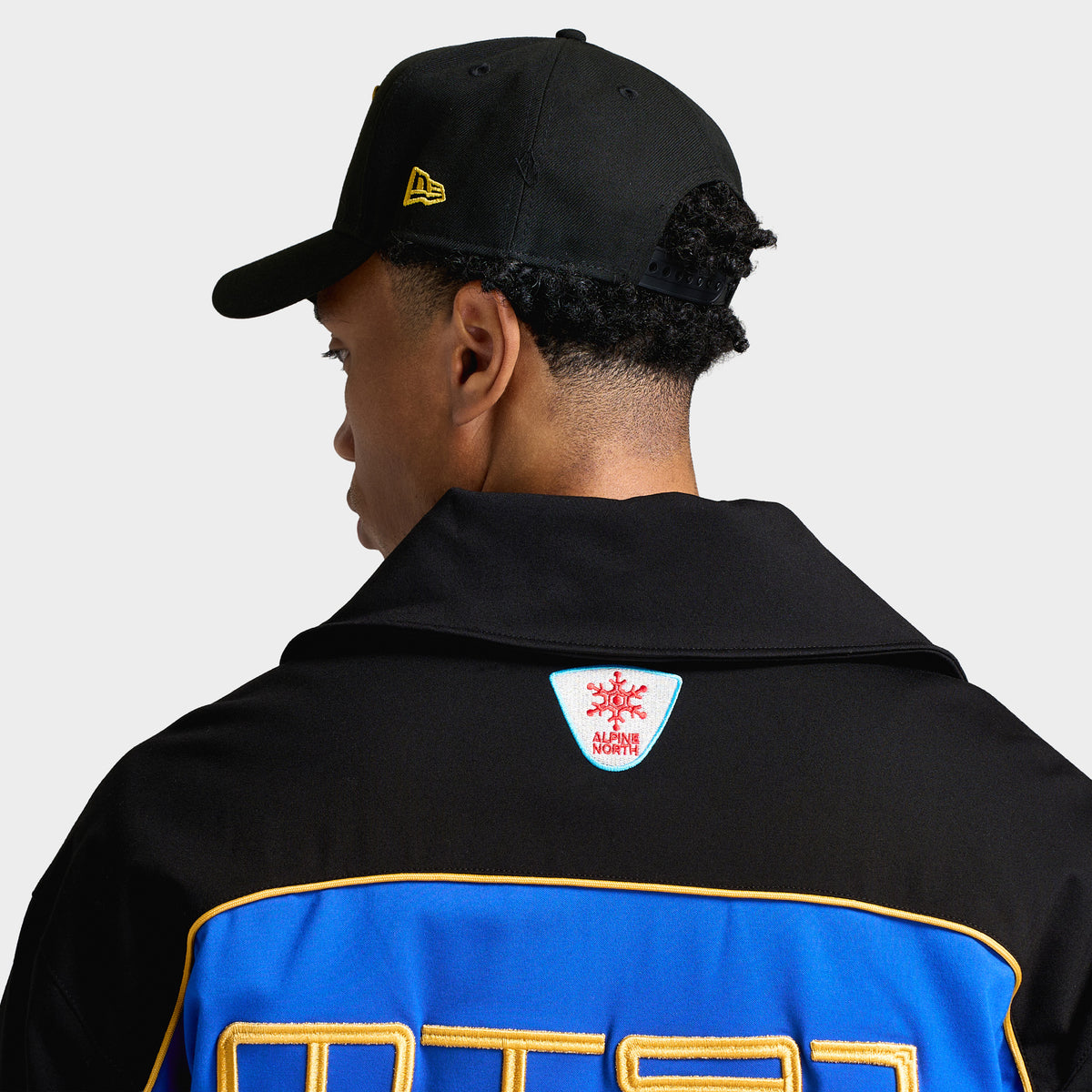 New Era Oakland Athletics Upside Down 9FORTY A-Frame. Back view on model displaying structured black crown, embroidered yellow New Era flag, and adjustable black snapback closure.