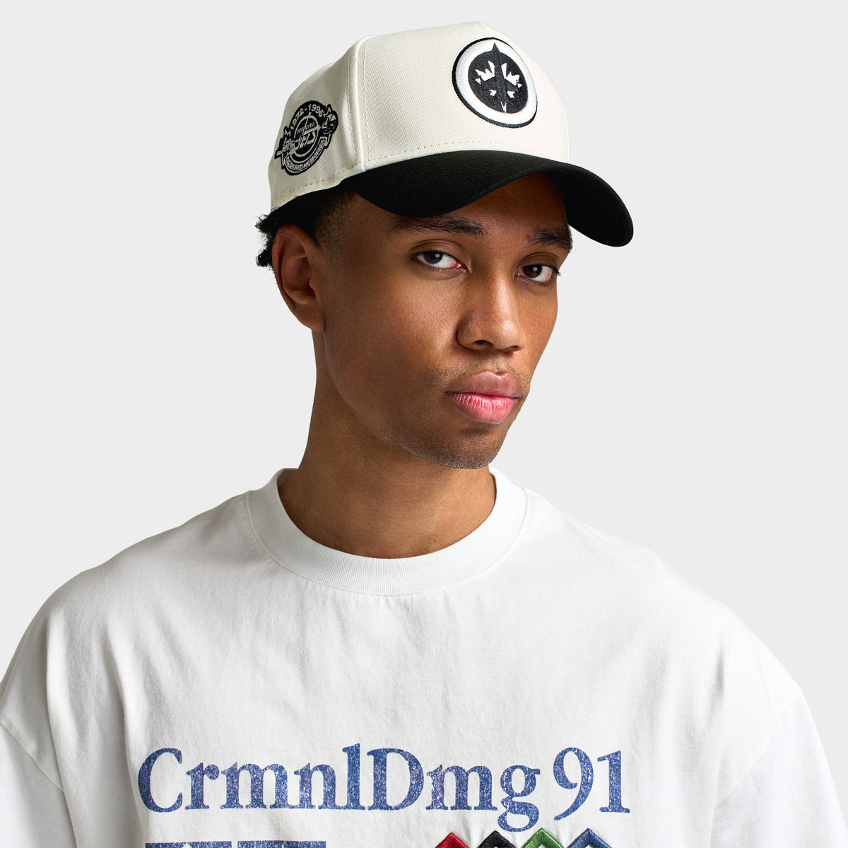 New Era Winnipeg Jets 9FORTY A-Frame. Front view on model featuring chrome white crown, black embroidered Jets logo patch, curved black visor, and side patch.
