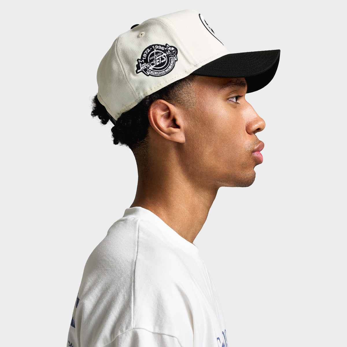 New Era Winnipeg Jets 9FORTY A-Frame. Side profile view showcasing high A-frame chrome crown, black curved visor, and detailed embroidered side patch.
