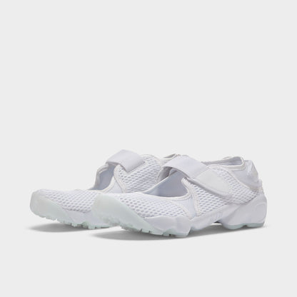 Nike Women's Air Rift Breathe. Three-quarter view of white split-toe sneakers with mesh uppers, adjustable straps and rounded soles.