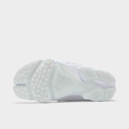 Nike Women's Air Rift Breathe. Bottom view of white split-toe sneaker showing segmented outsole with rounded tread sections.