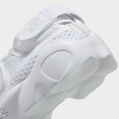 Nike Women's Air Rift Breathe. Close-up of white split-toe sneaker showing rounded outsole pods and sculpted heel.