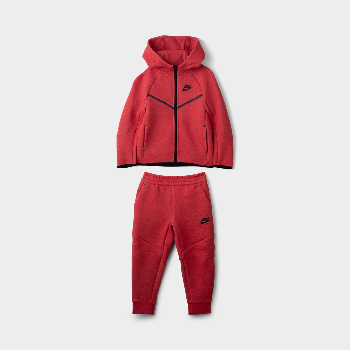 Nike Children's Sportswear Tech Fleece Full Zip Hoodie Set. Front view of light university red and heather hoodie and jogger set with black Nike branding.