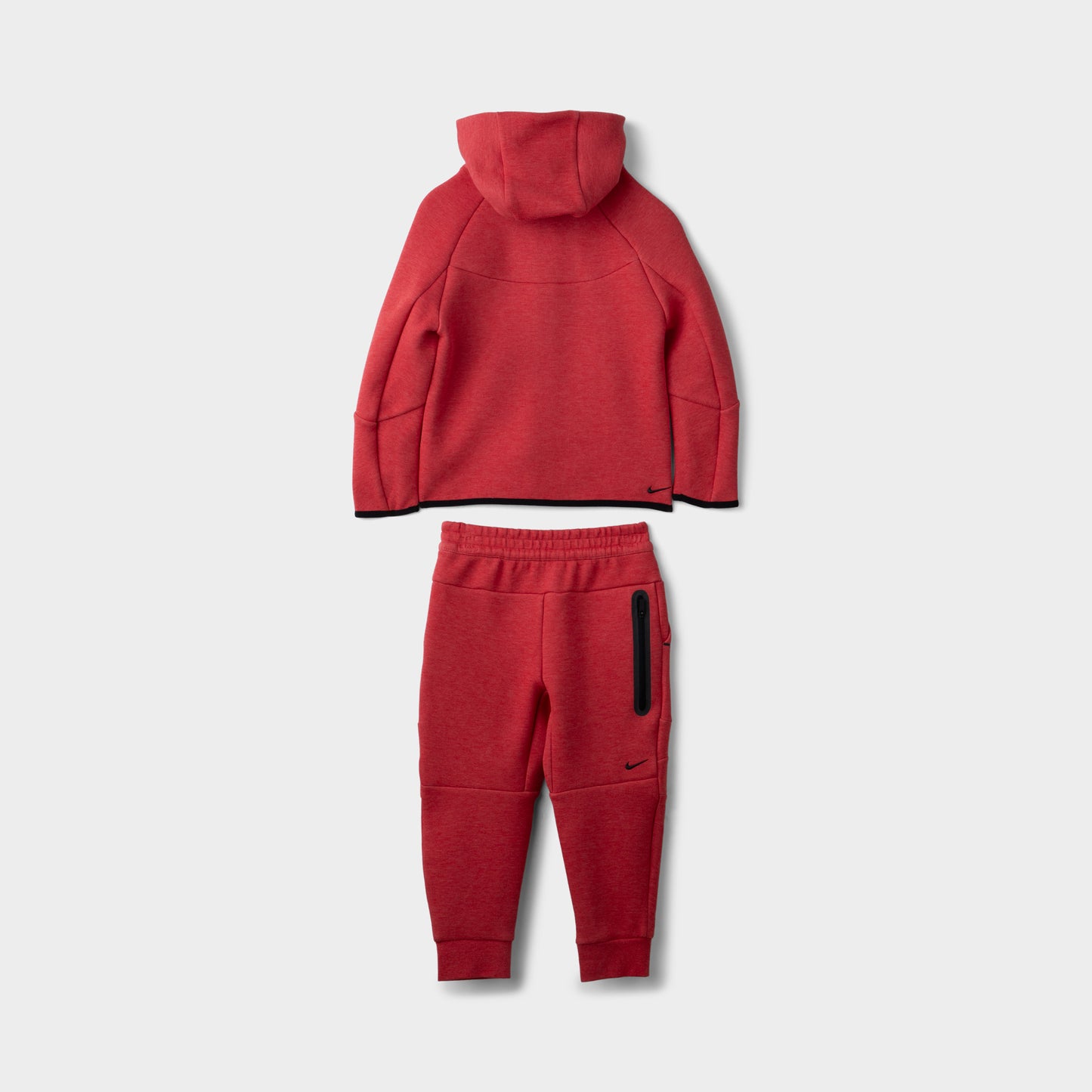 Nike Children's Sportswear Tech Fleece Full Zip Hoodie Set. Full view of light university red and heather hoodie and joggers with matching black Nike logos.