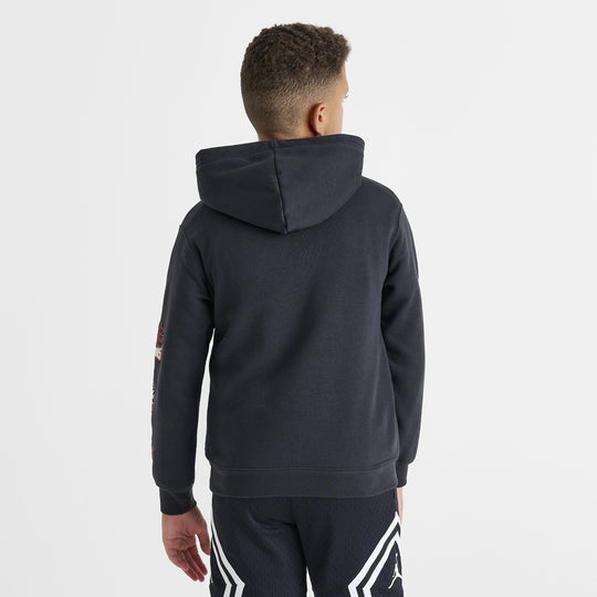 Jordan Juniors' Varsity Split Pullover Hoodie. Back view of model wearing off noir hoodie with raised hood and plain back.