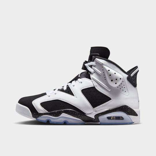 Jordan 6 Retro GS. Side view of the sneaker in white, chrome and black with perforated leather panels, black overlays and an icy translucent outsole.