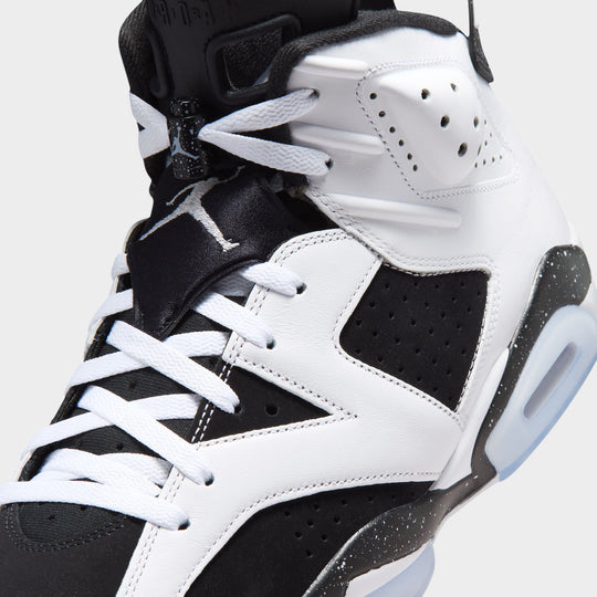 Jordan 6 Retro GS. Close-up of the upper showing white laces, perforated leather, black paneling and the padded tongue area.