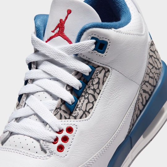 Jordan 3 Retro GS. Close-up of White, Varsity Red, and True Blue sneaker with embroidered Jumpman logo on tongue.