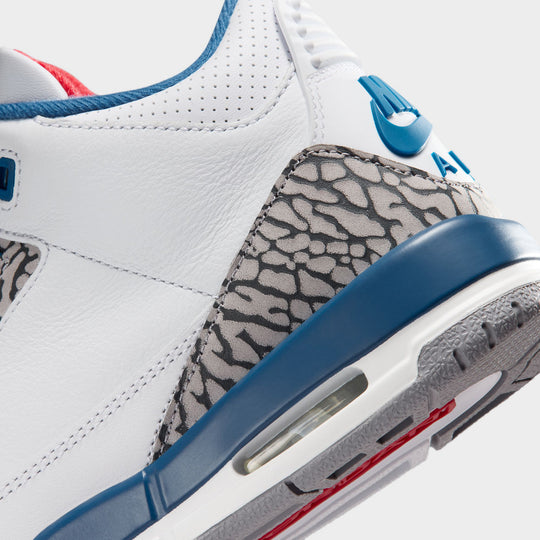 Jordan 3 Retro GS. Close-up of White, Varsity Red, and True Blue sneaker with visible Air unit.