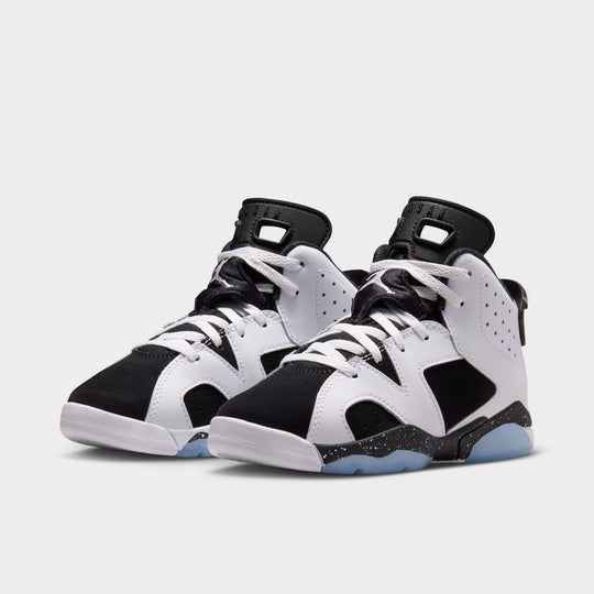 Jordan 6 Retro GS. Angled view of the pair in white, chrome and black showing the high-top shape, lace cover and visible Air unit.