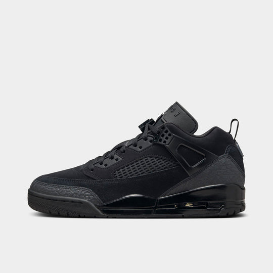 Jordan Spizike Low. Side view of black, black and anthracite sneaker with layered panels, mesh detailing and visible Air cushioning.