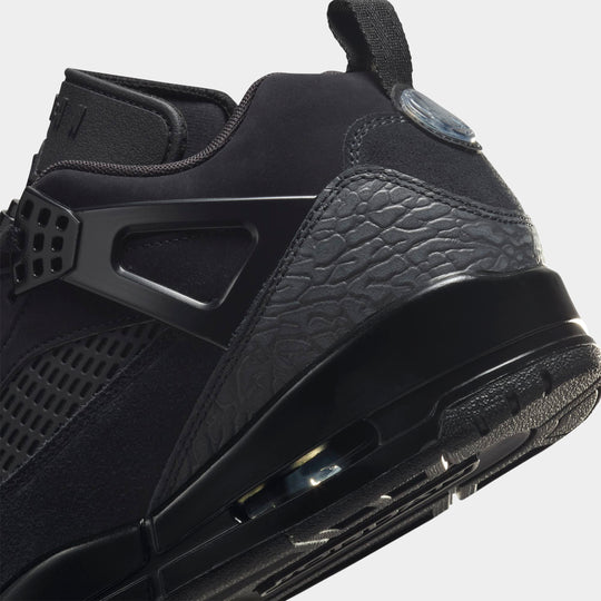 Jordan Spizike Low. Close-up of black and anthracite sneaker showing the heel structure, textured paneling and visible Air unit.