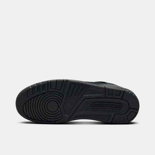 Jordan Spizike Low. Bottom view of black and anthracite sneaker showing black outsole with textured traction pattern.