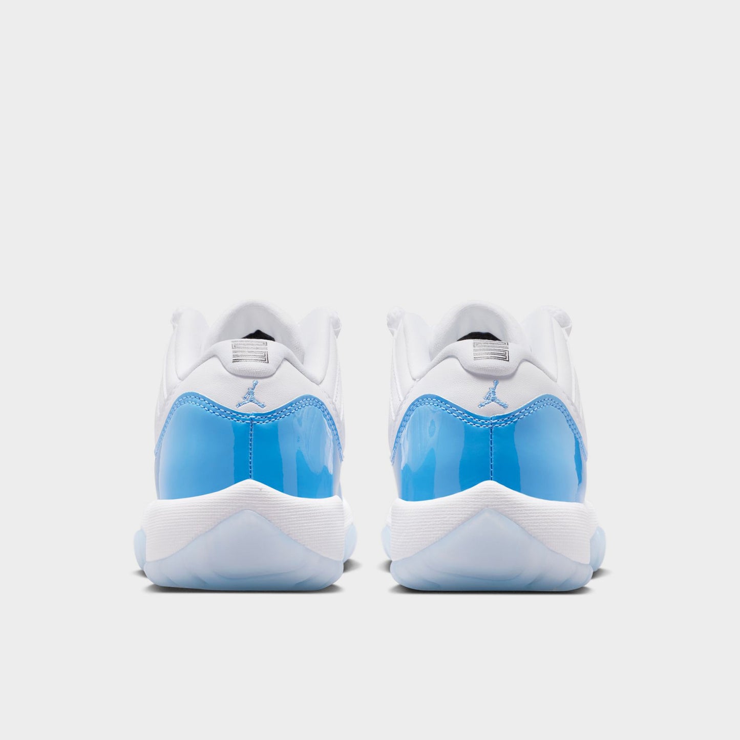 Jordan 11 Low Retro GS Blanc / Bleu universitaire - Noir