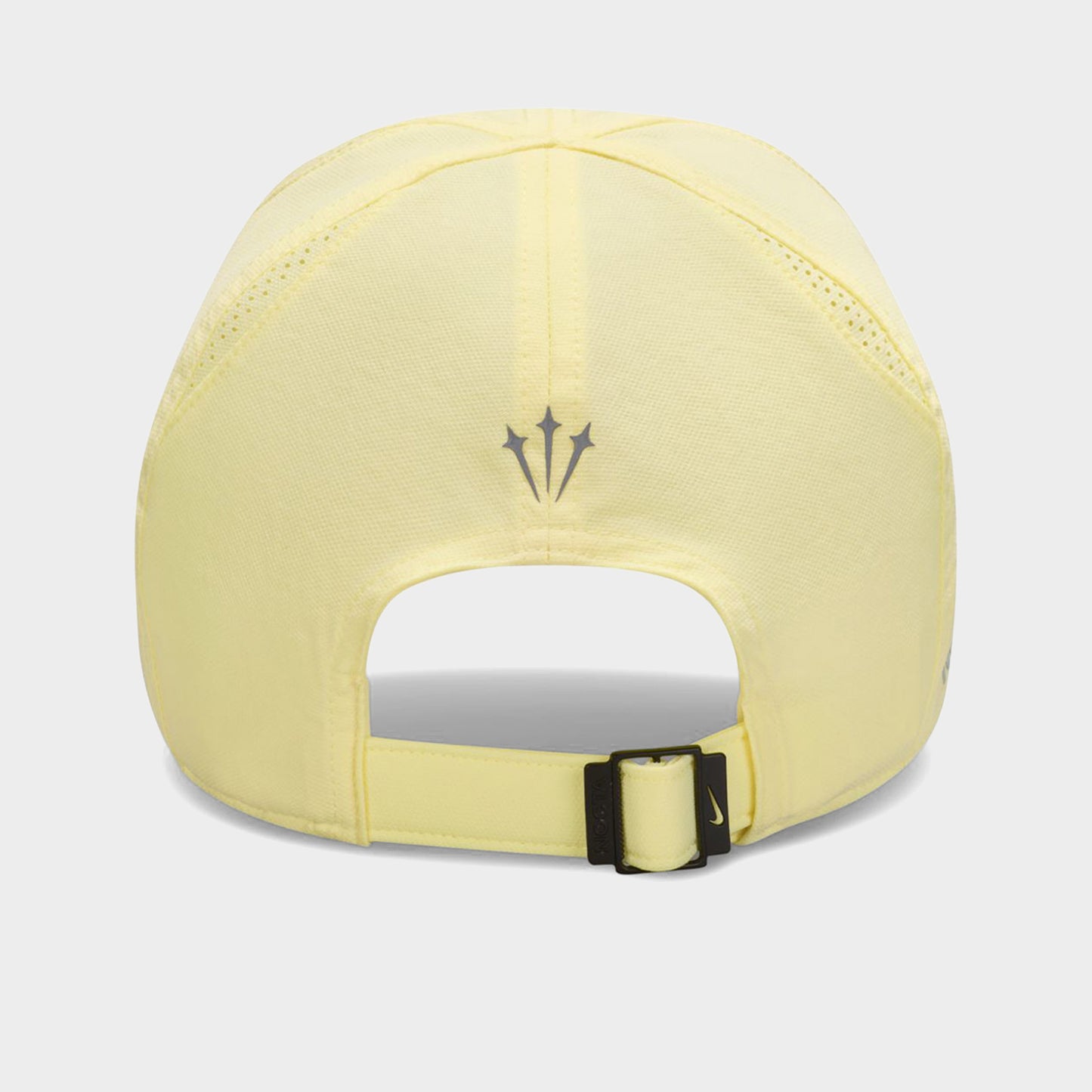 Nike NOCTA S.S.C. Cap CS. Back view of alabaster and platinum tint cap showing adjustable opening and tonal NOCTA branding.