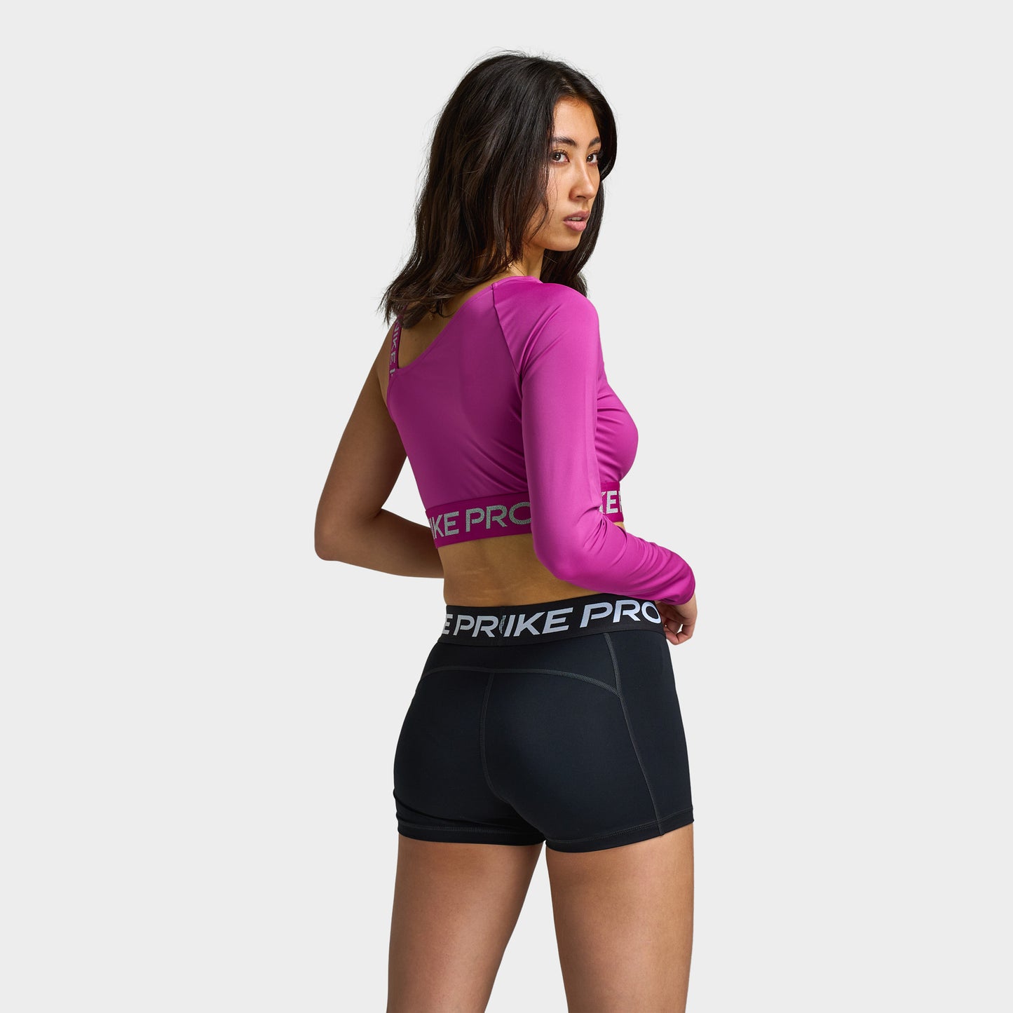 Nike Pro Shine Women's Dri-FIT Asymmetrical Cropped Top / Pink