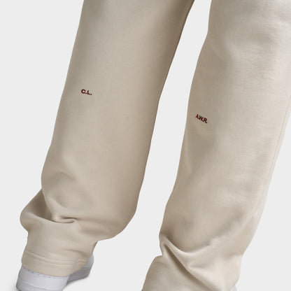Nike NOCTA Cardinal Fleece Open Hem Sweatpants Light Orewood Brown / Team Red
