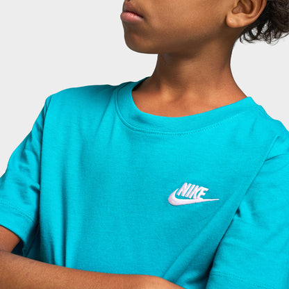Nike Juniors' Futura T-Shirt. Close-up view of upper chest highlighting energy green turquoise jersey fabric, ribbed crewneck collar, and small white embroidered Nike Futura logo on the left chest. 