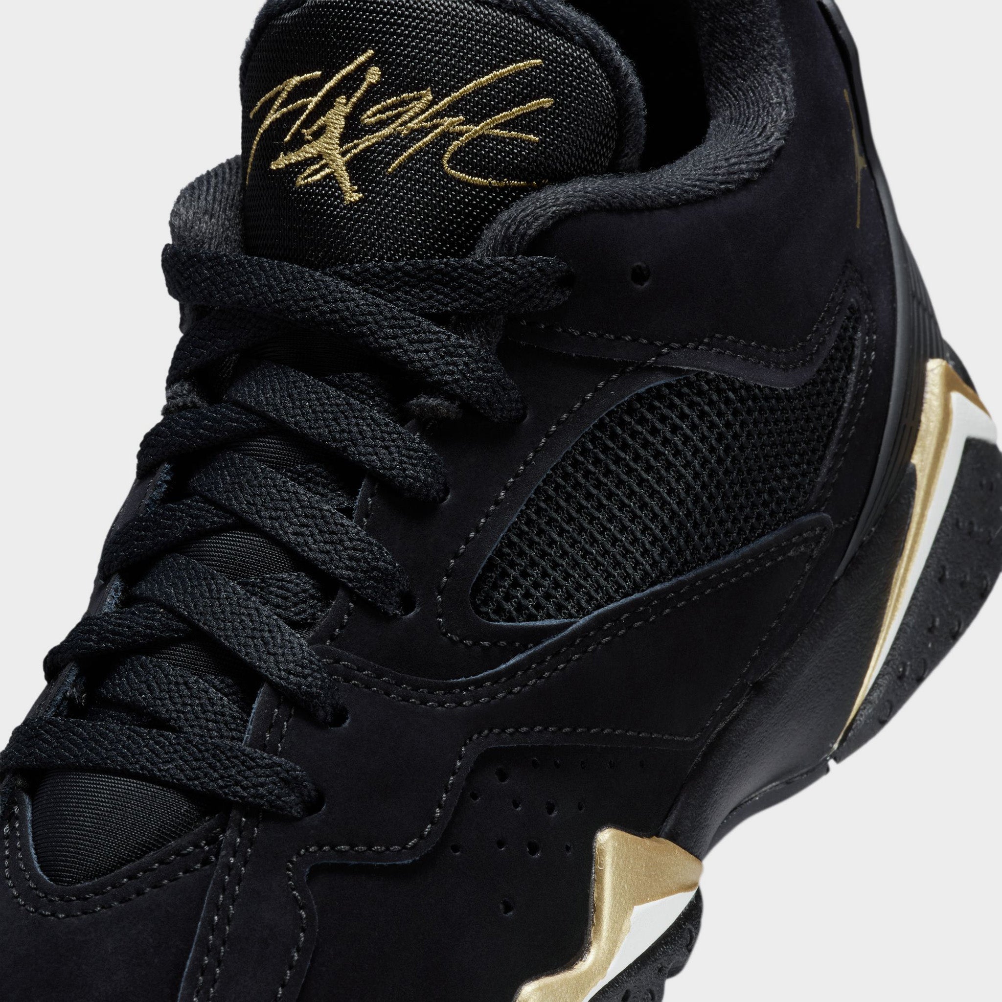 gold and black jordan 7s