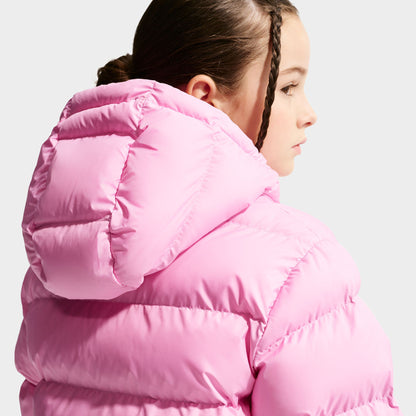 Nike Junior Girls' Therma-FIT Loose-Fit Puffer Jacket. Back three-quarter view of pink rise puffer jacket showing hood, quilted back panels and raised collar.