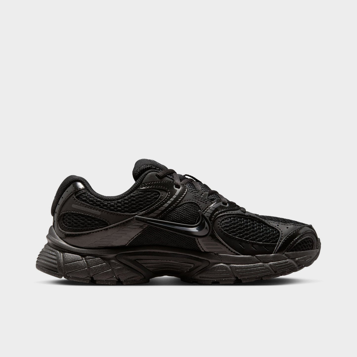 Nike Women's V5 RNR. Opposite side view of black and anthracite sneaker with layered panels, tonal Swoosh and sculpted sole.