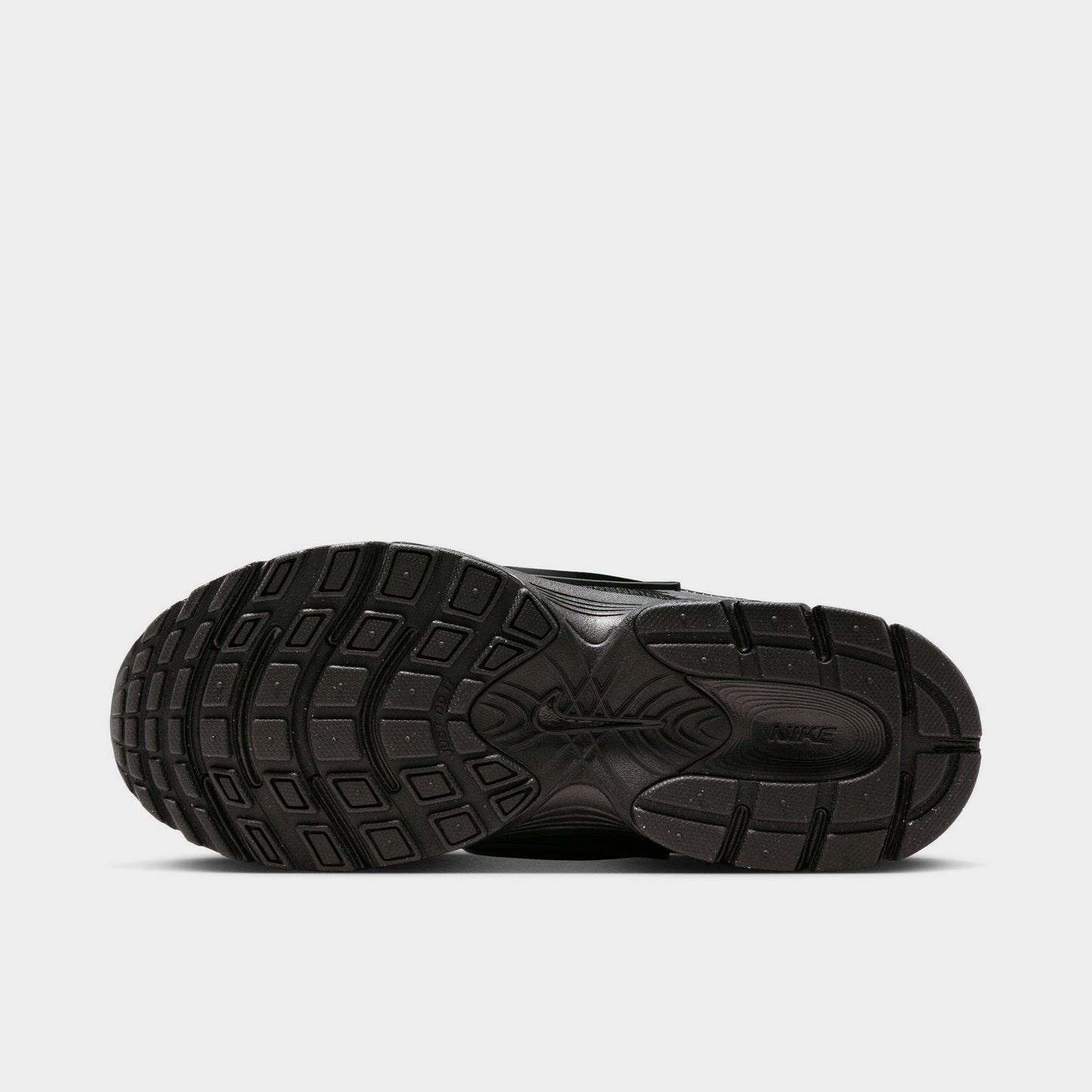 Nike Women's V5 RNR. Bottom view of black and anthracite sneaker showing segmented outsole with curved tread sections.