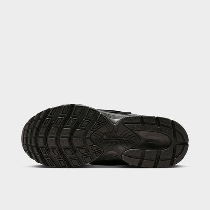 Nike Women's V5 RNR. Bottom view of black and anthracite sneaker showing segmented outsole with curved tread sections.