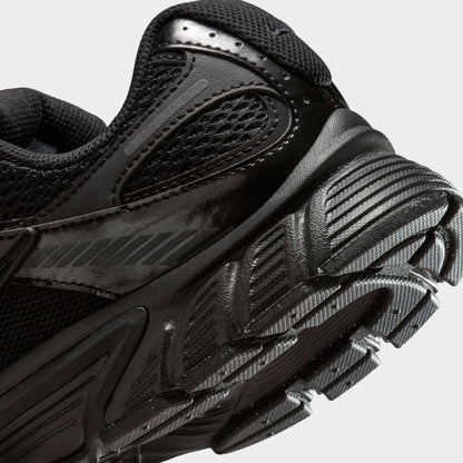 Nike Women's V5 RNR. Close-up of black and anthracite sneaker showing layered heel panels, tonal Swoosh and textured outsole edge.