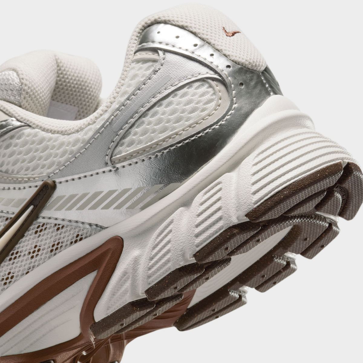 Nike Women's V5 RNR Salt / Light Orewood Brown - Fauna Brown close-up, cream sneakers showing mesh panels, brown midsole accents and Nike Swoosh.