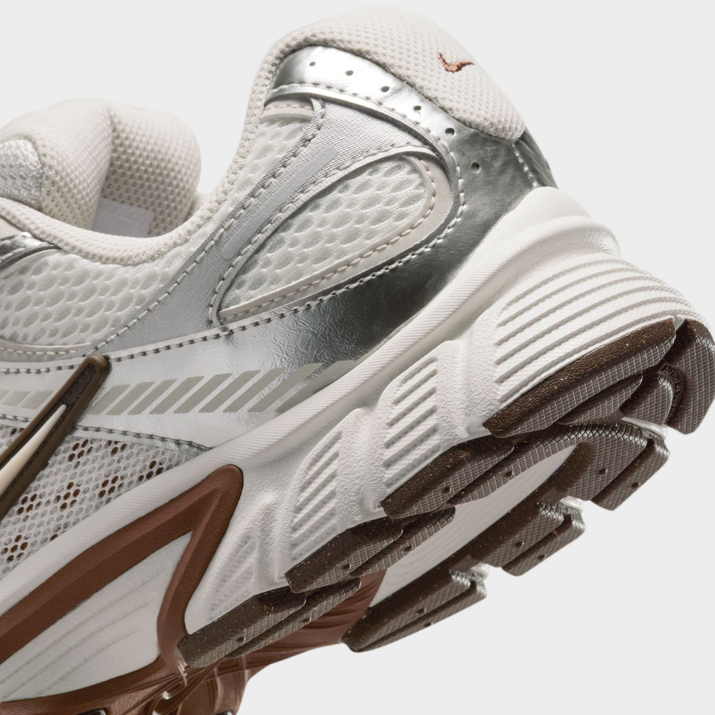 Nike Women's V5 RNR Salt / Light Orewood Brown - Fauna Brown close-up, cream sneakers showing mesh panels, brown midsole accents and Nike Swoosh.