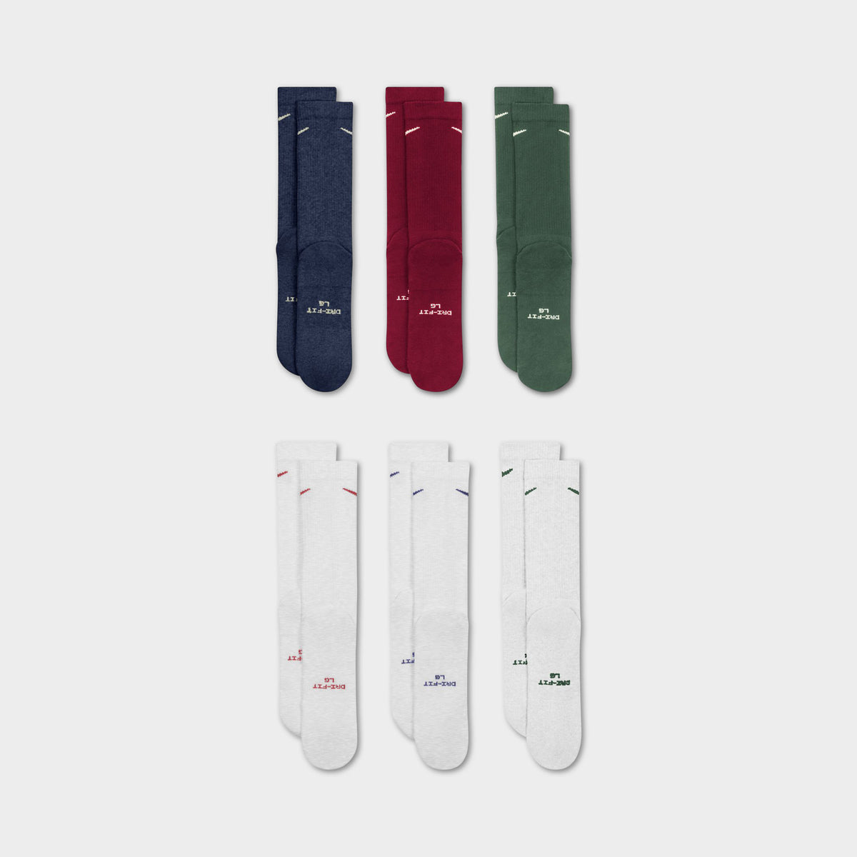 Nike Everyday Elevated Crew Socks (6-Pack). Flat-lay view of multicolour crew socks arranged in navy, red, green and white pairs.