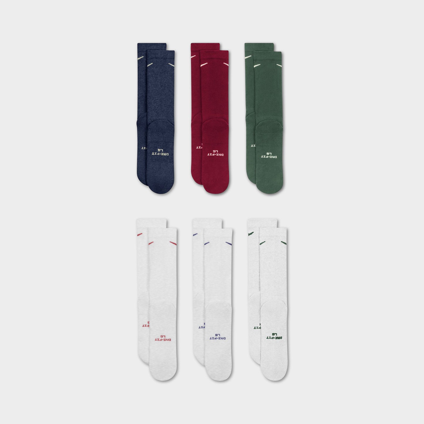 Nike Everyday Elevated Crew Socks (6-Pack). Flat-lay view of multicolour crew socks arranged in navy, red, green and white pairs.