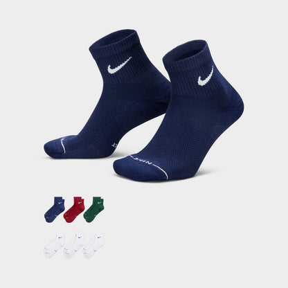 Nike Everyday Elevated Ankle Socks (6-Pack). Three-quarter view of navy ankle socks beside the multicolour sock assortment.