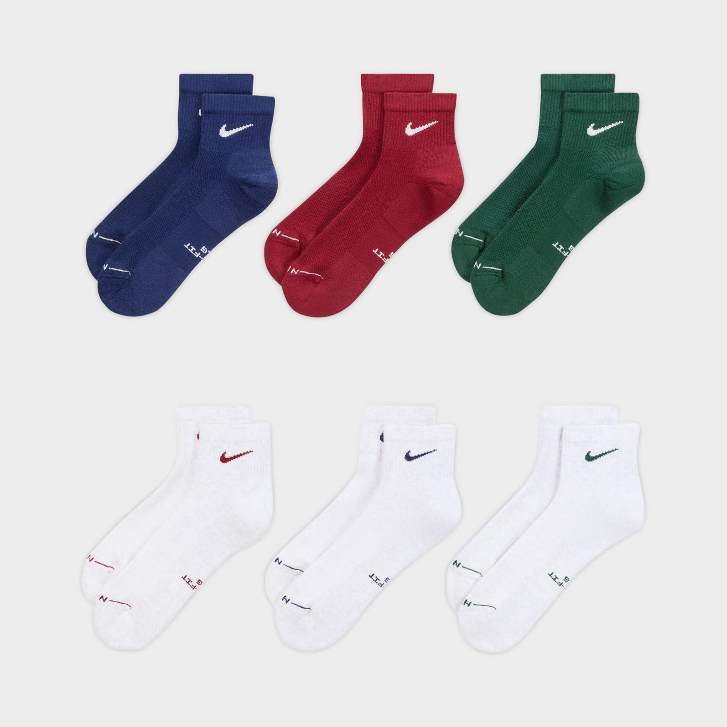 Nike Everyday Elevated Ankle Socks (6-Pack). Front view of multicolour ankle socks in navy, red, green and white with Nike Swoosh logos.