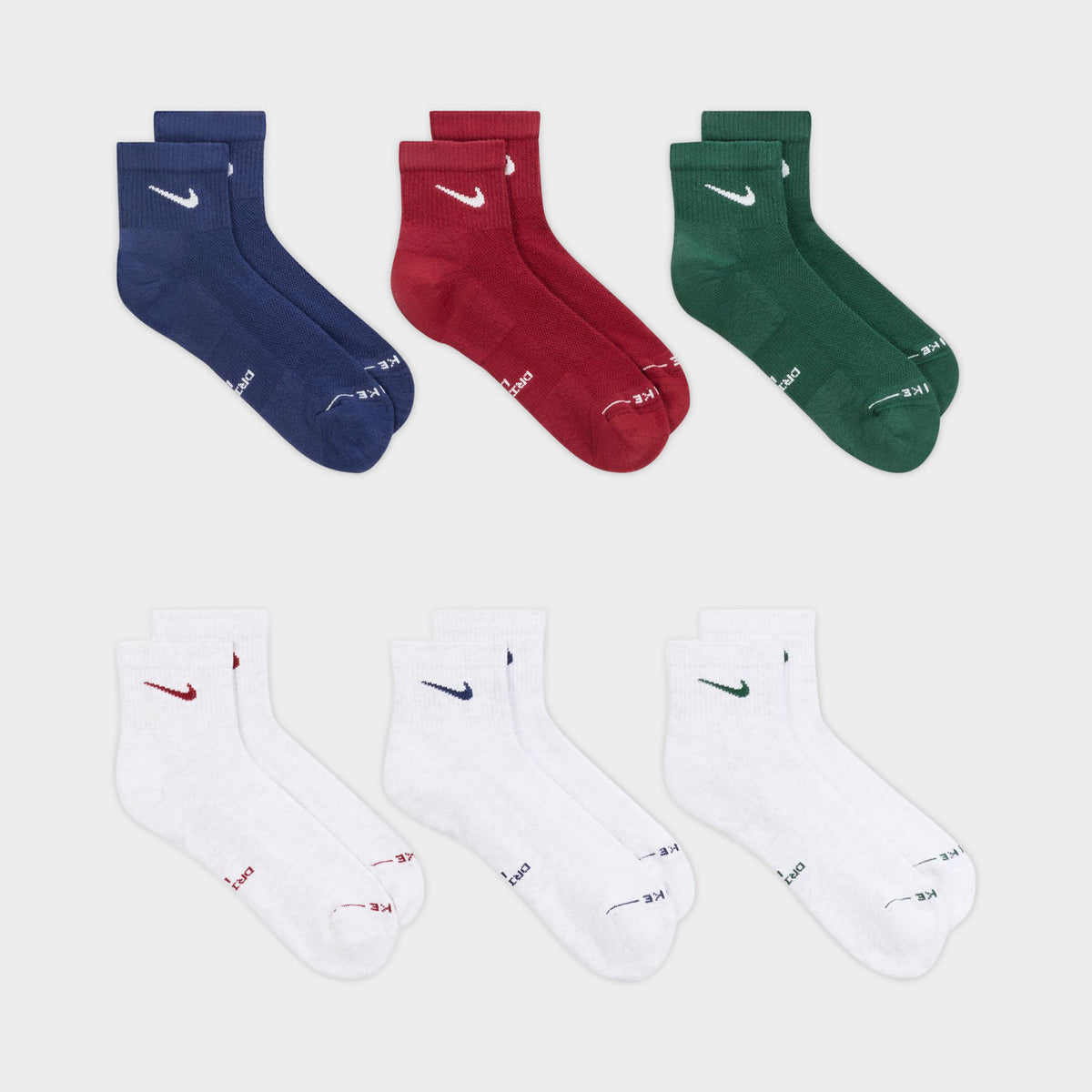 Nike Everyday Elevated Ankle Socks (6-Pack). Flat-lay view of multicolour ankle socks arranged in navy, red, green and white pairs.