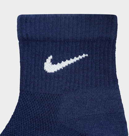 Nike Everyday Elevated Ankle Socks (6-Pack). Close-up of navy ankle sock showing ribbed knit texture and white Nike Swoosh logo.