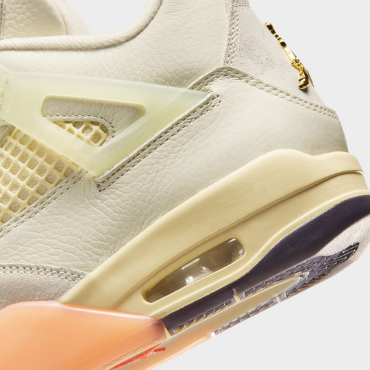 Jordan Women’s 4 Retro. Close-up of Coconut Milk, Muslin, and Bright Mango sneakers with an Encapsulated Air-Sole unit.
