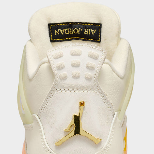 Jordan Women’s 4 Retro. Close-up rear view of Coconut Milk, Muslin, and Bright Mango sneakers with metallic Jumpman logo on heel.