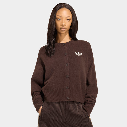 adidas Women's Essentials Knit Cardigan. Aurora coffee brown fine-knit cardigan featuring round crew neckline, front button closure, relaxed fit, and white jacquard knit Trefoil logo on the chest. 