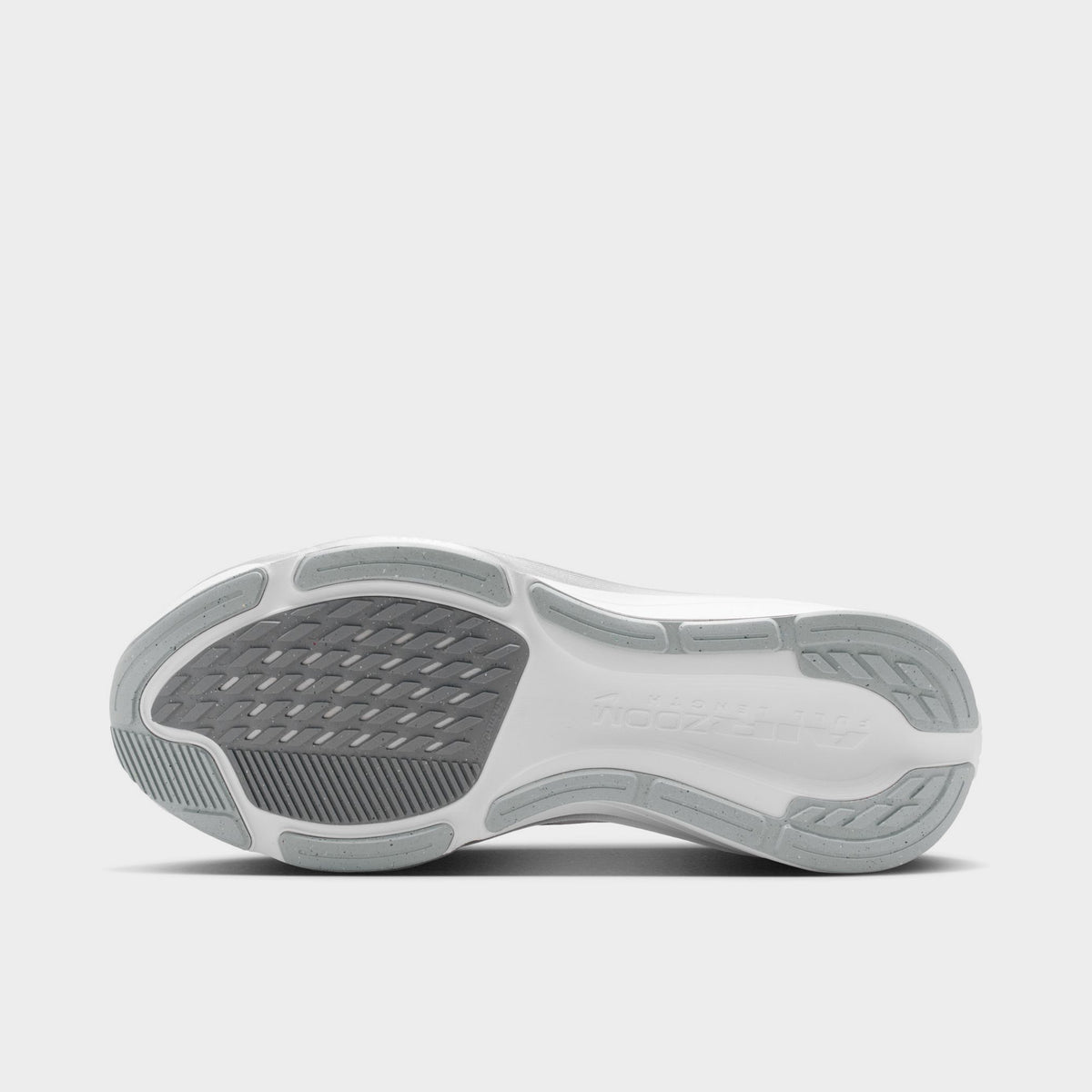 Nike Women's Pegasus 42. Bottom view of white, metallic silver and wolf grey running shoe showing grey rubber sections and segmented tread.