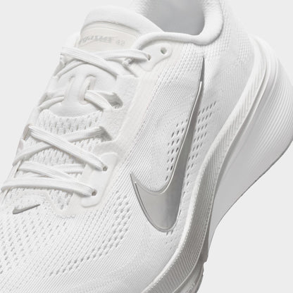 Nike Women's Pegasus 42. Close-up of white, metallic silver and wolf grey running shoe showing white laces, mesh panels and silver Swoosh.