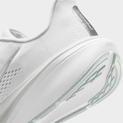 Nike Women's Pegasus 42. Close-up of white, metallic silver and wolf grey running shoe showing padded heel, reflective strip and layered midsole.