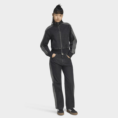 adidas Firebird Denim Track Top. Full-body view of model wearing true black denim track jacket with matching pants and black shoes.