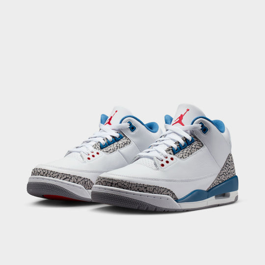 Jordan 3 Retro. Three-quarter view of White, True Blue, and Fire Red sneaker with visible Air unit.