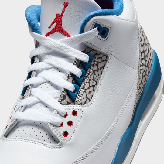 Jordan 3 Retro. Close-up view of White, True Blue, and Fire Red sneaker with embroidered Jumpman logo on tongue.
