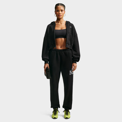 Nike Studio Fleece Cropped Full Zip Hoodie. Full-body front view of model wearing black cropped hoodie with matching black pants.